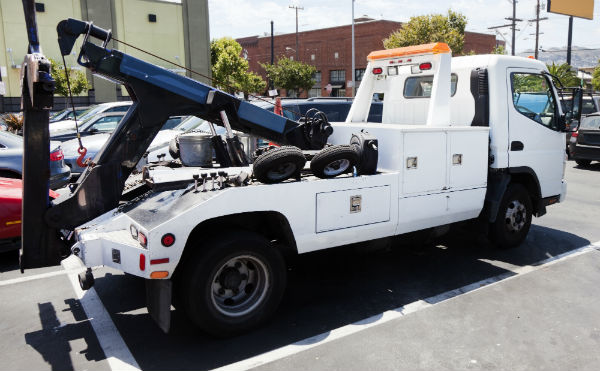 white tow truck ready for work