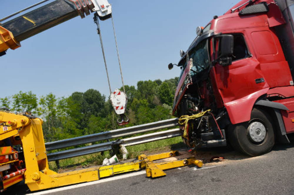 crane and a tow truck tow