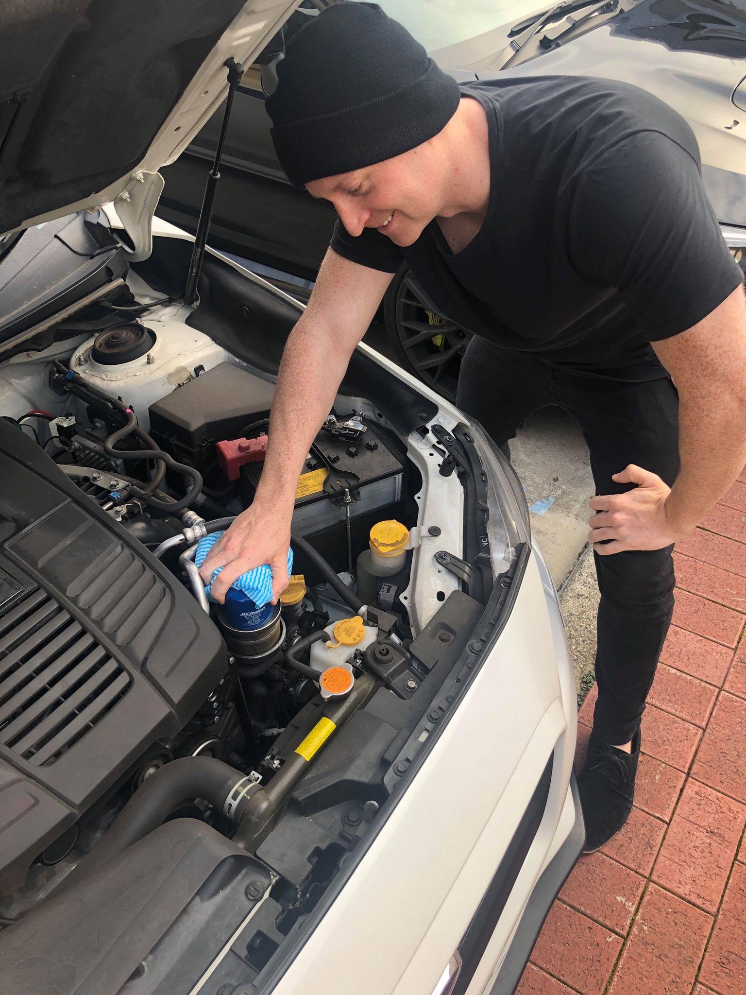 Person changing oil filter