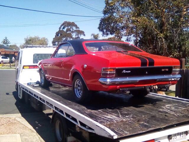 Show car towing service; towing a Holden Monaro. 