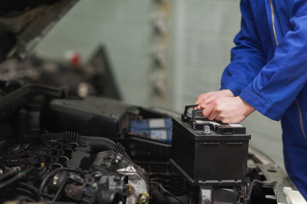 Installing a new car battery.