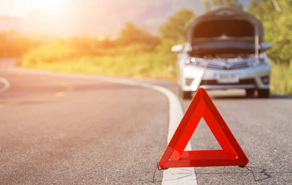 Road warning device and broken down car.