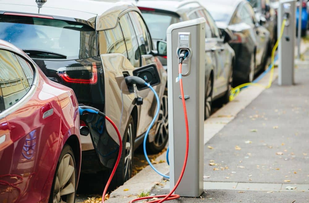 Line of electric vehicles charging.