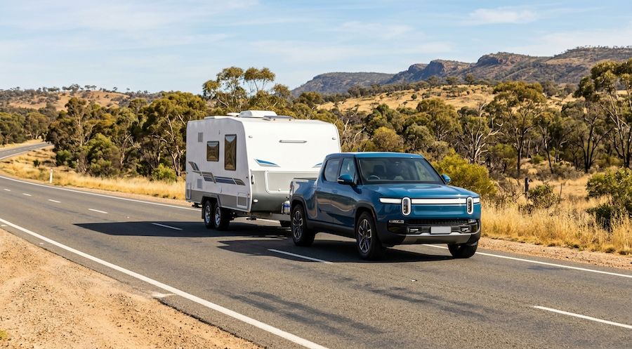 Electric vehicle towing a caravan on a highway near Melbourne Australia demonstrating EV towing capability